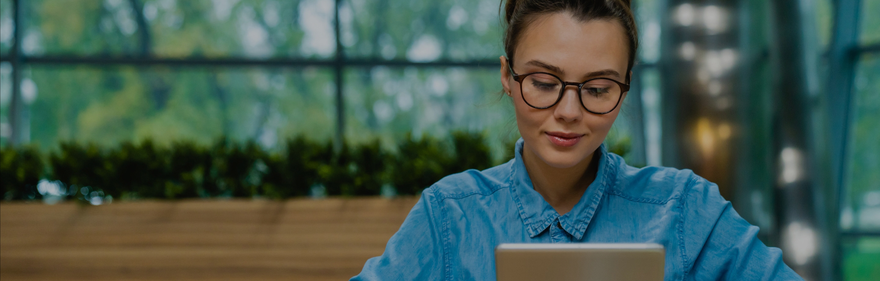 young women looking at her ipad