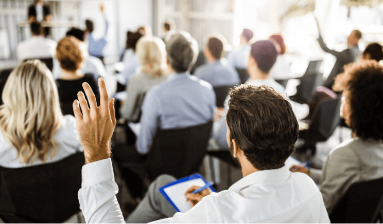 Adults in seminar listening to speaker